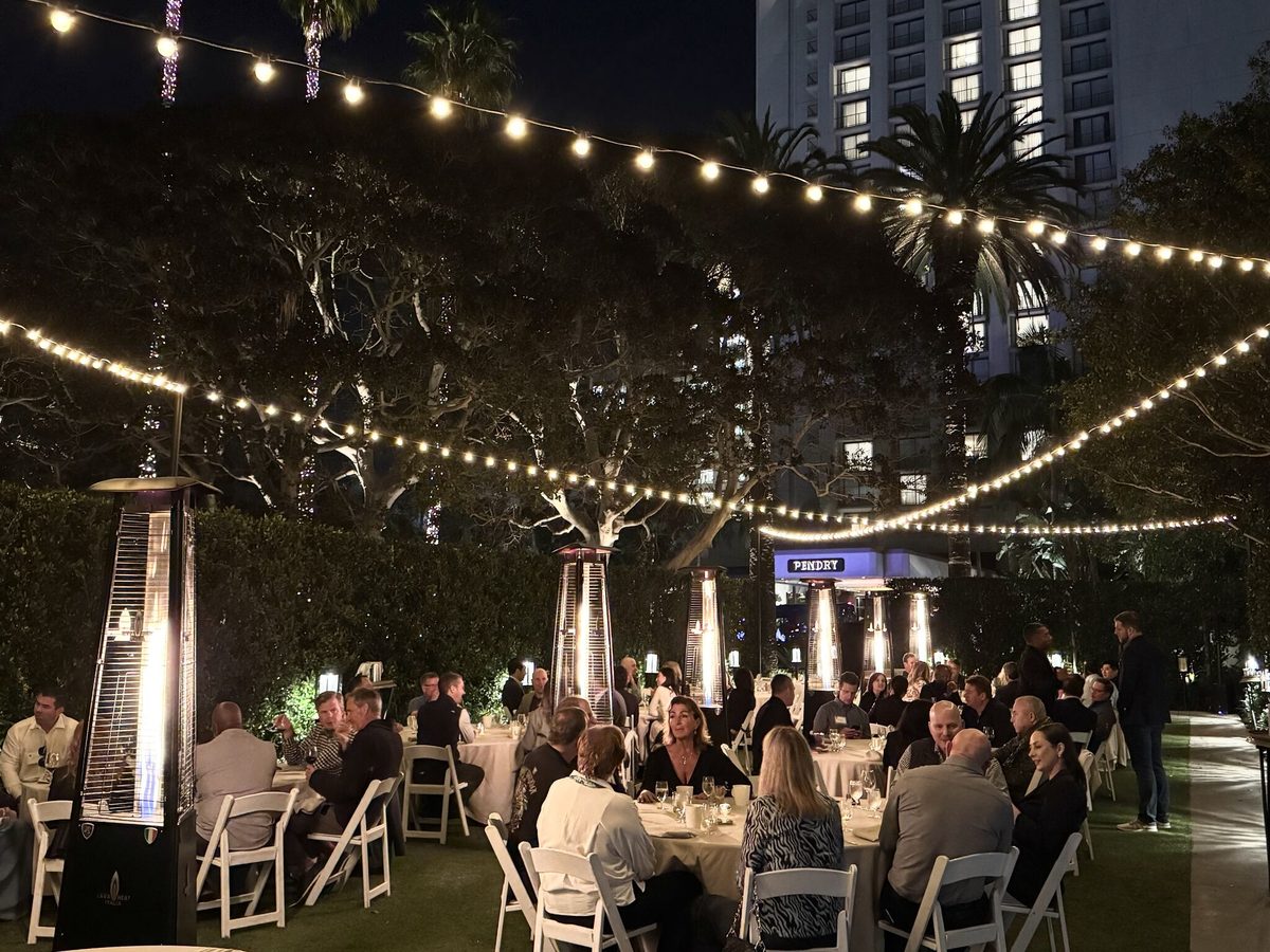 An Insight Summits dinner under string lights